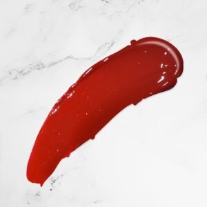 Photo of Radical Cosmetics' Ruby Red Lip Gloss, featuring a rich, deep red hue with a vibrant, glossy finish. This lip gloss delivers a luxurious, full-coverage color with a high-shine, smooth texture that glides effortlessly onto lips. The ruby red shade offers a bold and timeless look, perfect for creating a striking statement or adding a pop of dramatic color to your makeup routine. With its hydrating formula, this lip gloss nourishes the lips, leaving them soft, moisturized, and plump. Ideal for both day and evening wear, the ruby red gloss is a must-have for those who love bold, vibrant lip colors. Keywords: Ruby red lip gloss, red lip gloss, high-shine lip gloss, moisturizing lip gloss, glossy lip color, bold lip gloss, full-coverage lip gloss, smooth lip gloss, vibrant lip gloss, long-lasting lip gloss, plumping lip gloss, dramatic lip gloss, luxury lip gloss, statement lip gloss, hydrating lip gloss, softening lip gloss, vegan lip gloss, cruelty-free lip gloss, glossy red lip gloss, red lipstick alternative, radiant lip gloss.