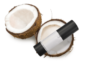 A luxurious bottle of Radical Cosmetics hair and body oil resting on top of a freshly split open coconut, showcasing the creamy white coconut flesh and rough brown shell. The oil is housed in a sleek, clear container with golden-hued liquid, reflecting a warm, natural glow. This clean beauty product is enriched with nourishing, plant-based ingredients ideal for moisturizing and revitalizing both skin and hair. Keywords: natural hair oil, hydrating body oil, coconut-infused skincare, clean beauty haircare, vegan body oil, cruelty-free cosmetics, organic hair and skin treatment, tropical beauty ingredients, eco-conscious personal care, and sustainable cosmetic packaging.