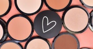 Radical Cosmetics Pressed Foundation with Artistic White Heart Design – A collection of pressed foundations in various shades, beautifully arranged in an artistic formation, with one foundation featuring a white heart drawn on the cover. The foundations are available in a range of shades, from light to deep, with neutral, warm, and cool undertones to suit all skin tones. The pressed powder formula offers buildable coverage, delivering a smooth, matte finish while controlling shine throughout the day. Ideal for creating a flawless complexion, this foundation blends effortlessly to even out skin tone, conceal imperfections, and provide a natural-looking, airbrushed finish. The lightweight, non-comedogenic formula ensures breathable wear without clogging pores, making it suitable for all skin types, including sensitive skin. The sleek, compact design makes it easy to carry for on-the-go touch-ups. Cruelty-free and formulated without parabens, this pressed foundation is a must-have for anyone seeking high-performance, clean beauty makeup solutions. Perfect for everyday wear or special occasions, the pressed foundation provides a flawless canvas for any makeup look.