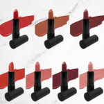 Swatches of seven matte lipstick shades showcasing bold berry, warm nude, and rich red tones with a velvety finish.