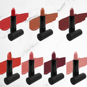 Swatches of seven matte lipstick shades showcasing bold berry, warm nude, and rich red tones with a velvety finish.