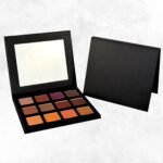 “Fireside Nights Eyeshadow Palette by Radical Cosmetics featuring 12 warm, high-pigment shades including Charmed, Wine, Bronze, and Rose Gold, cruelty-free, paraben-free, and made in the USA for fall-inspired eye looks